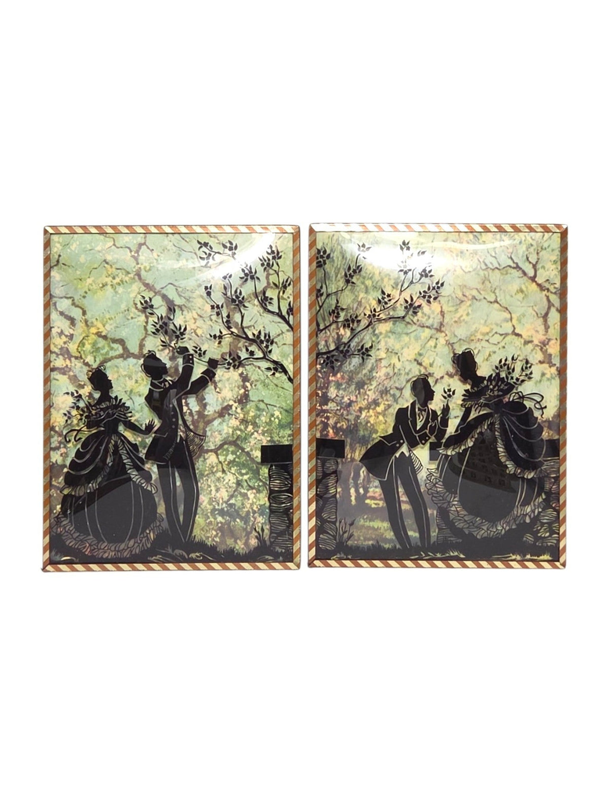 Pair of vintage reverse painted convex glass silhouette pictures