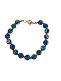 Murano style millefiori glass bead bracelet on white, aqua beads with flower canes knotted on aqua thread with gold-tone caps