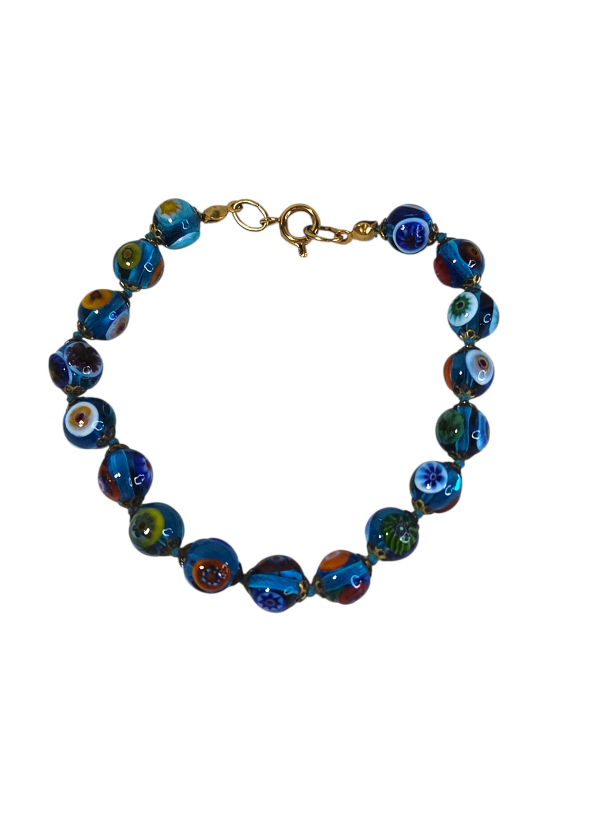Murano style millefiori glass bead bracelet on white, aqua beads with flower canes knotted on aqua thread with gold-tone caps
