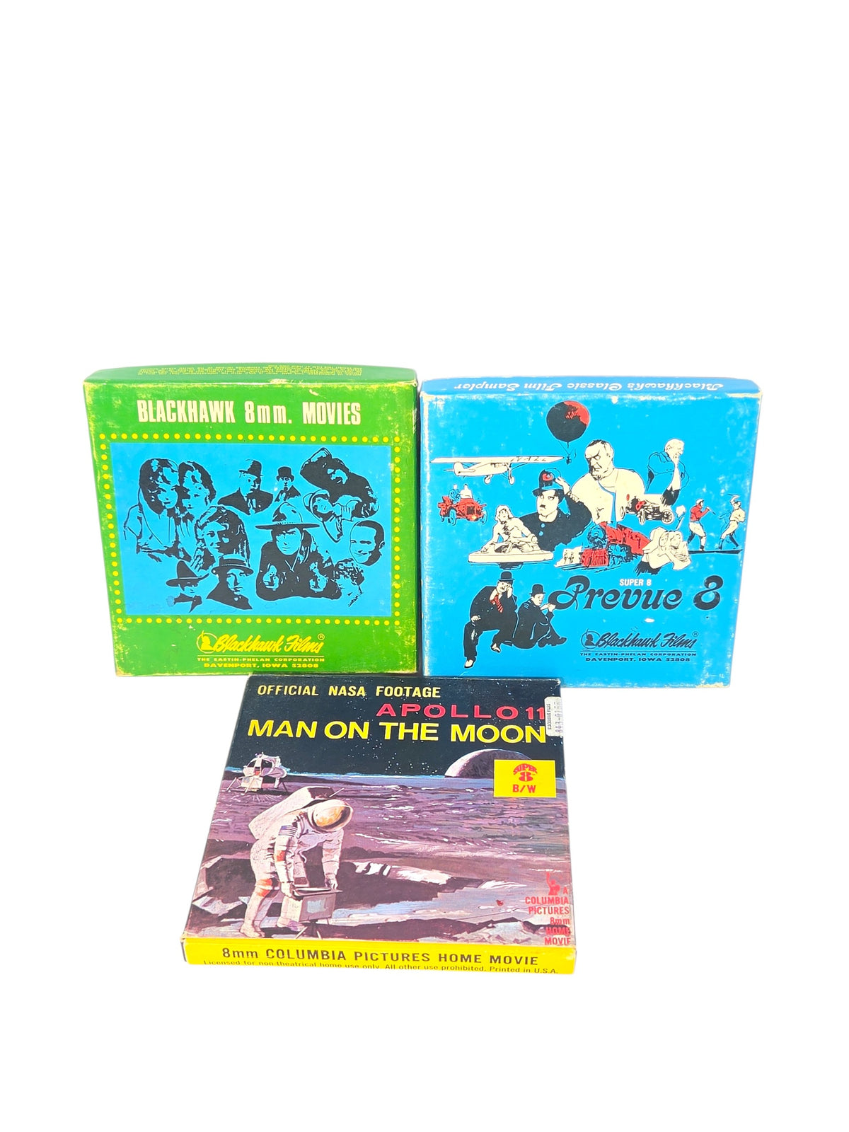 Three vintage Super 8 home movie boxes on white: green Blackhawk 8mm Movies, blue Prevue 8 and Columbia Apollo 11 Man on the Moon
