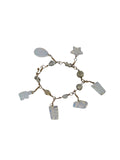 Handmade wire wrapped opalite charm bracelet on white with star, teardrop, frog, turtle and pineapple charms on gold-tone wire