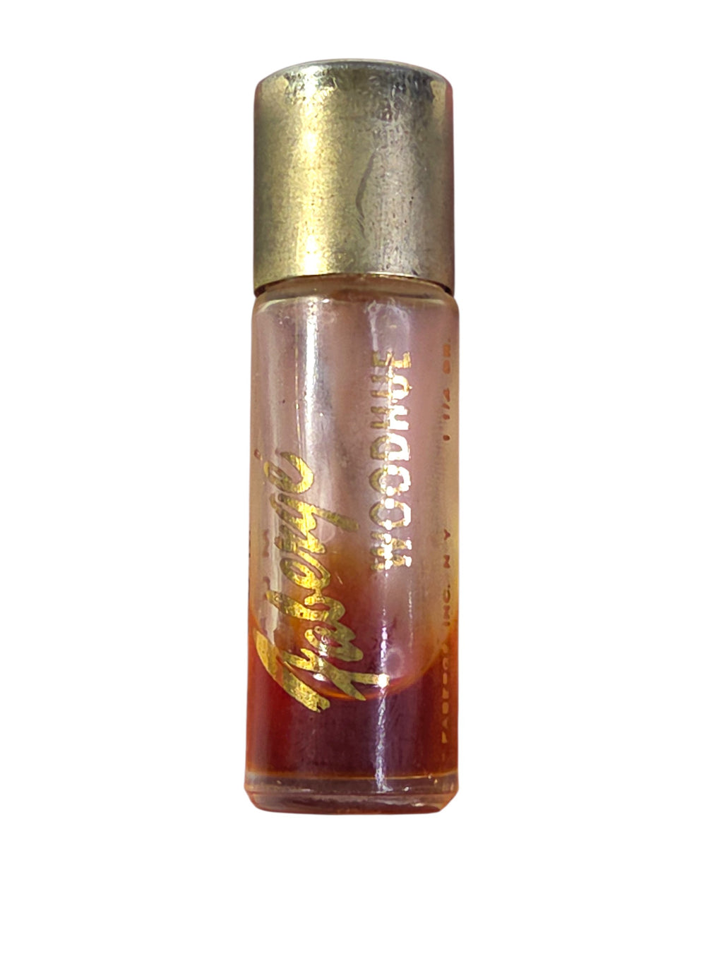Faberge Woodhue perfume in its leather Fabergette sleeve inside the clear box, beside a ruler, about 3 1/4 inches tall