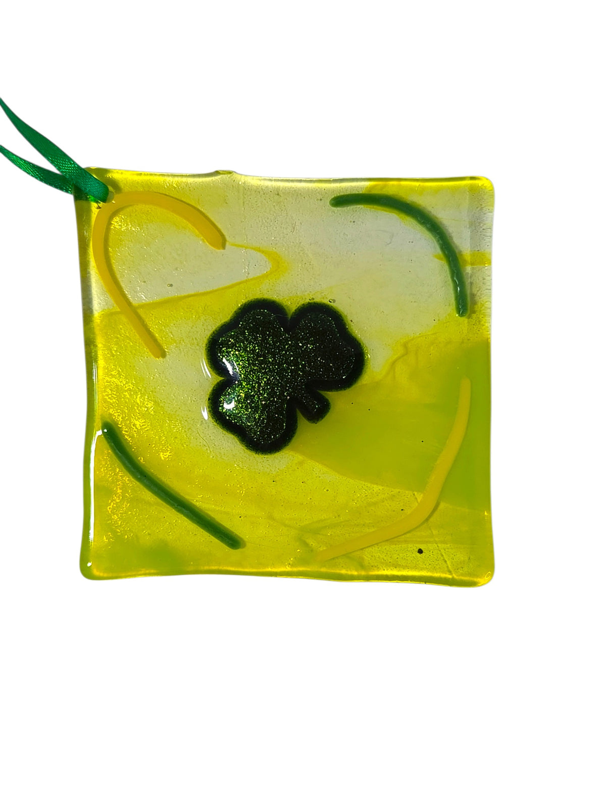 Clear fused glass suncatcher with three green shamrocks, an amber walking stick and a turquoise X, with hanging hole