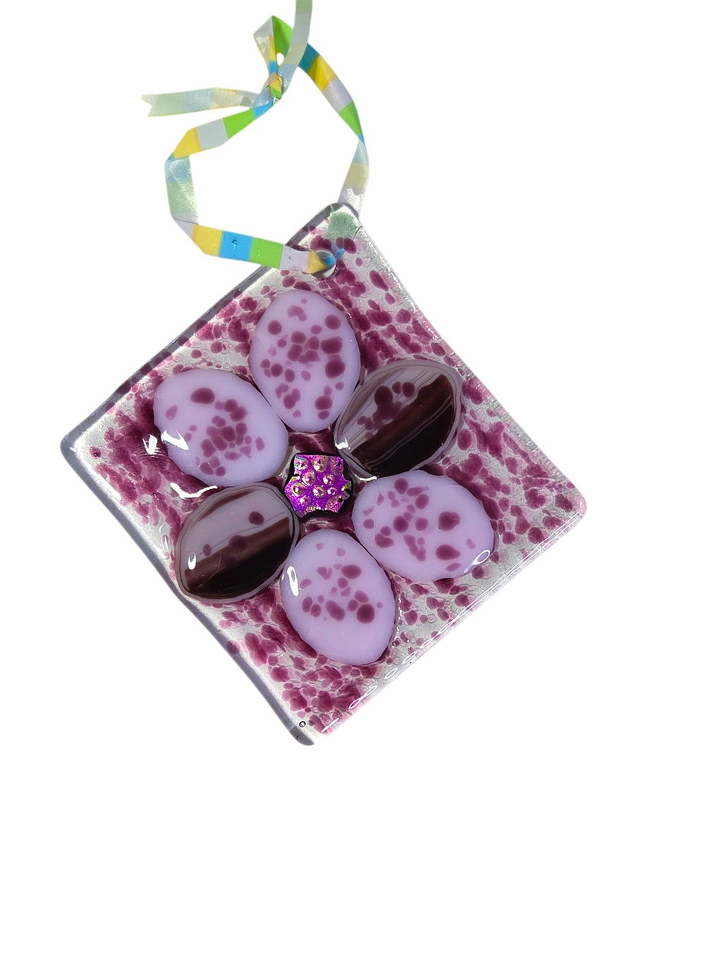 Purple fused glass flower suncatcher with speckled lavender petals, dichroic center and striped ribbon hanger