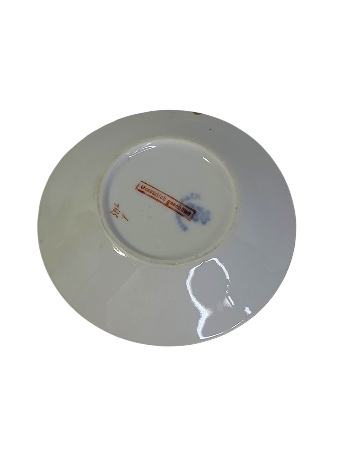 Full underside of the antique porcelain dish showing the foot ring and marks