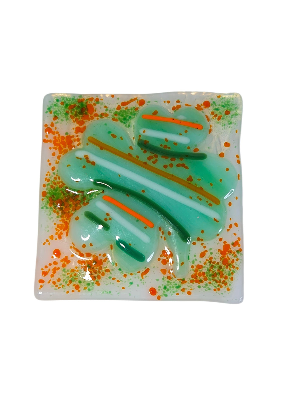 Clear fused glass suncatcher with three green shamrocks and a green and amber curved crook on a green ribbon