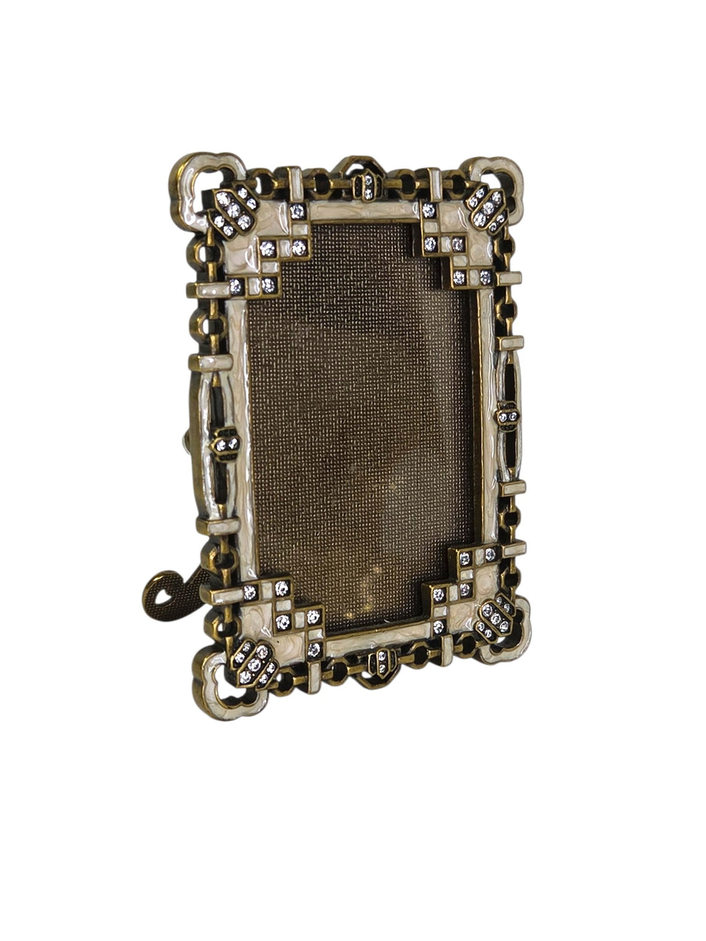 Argento jeweled enamel frame turned to the side, showing its depth and cloverleaf corners
