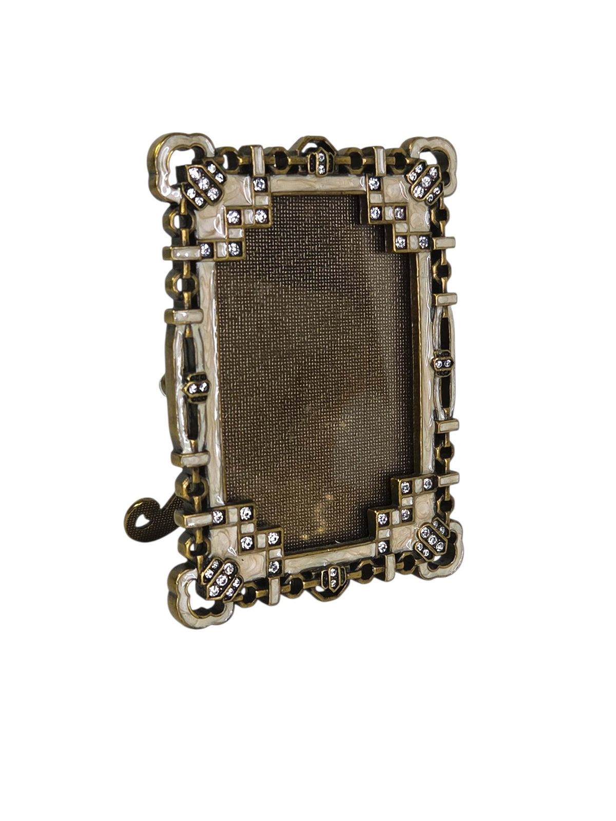 Argento jeweled enamel frame turned to the side, showing its depth and cloverleaf corners