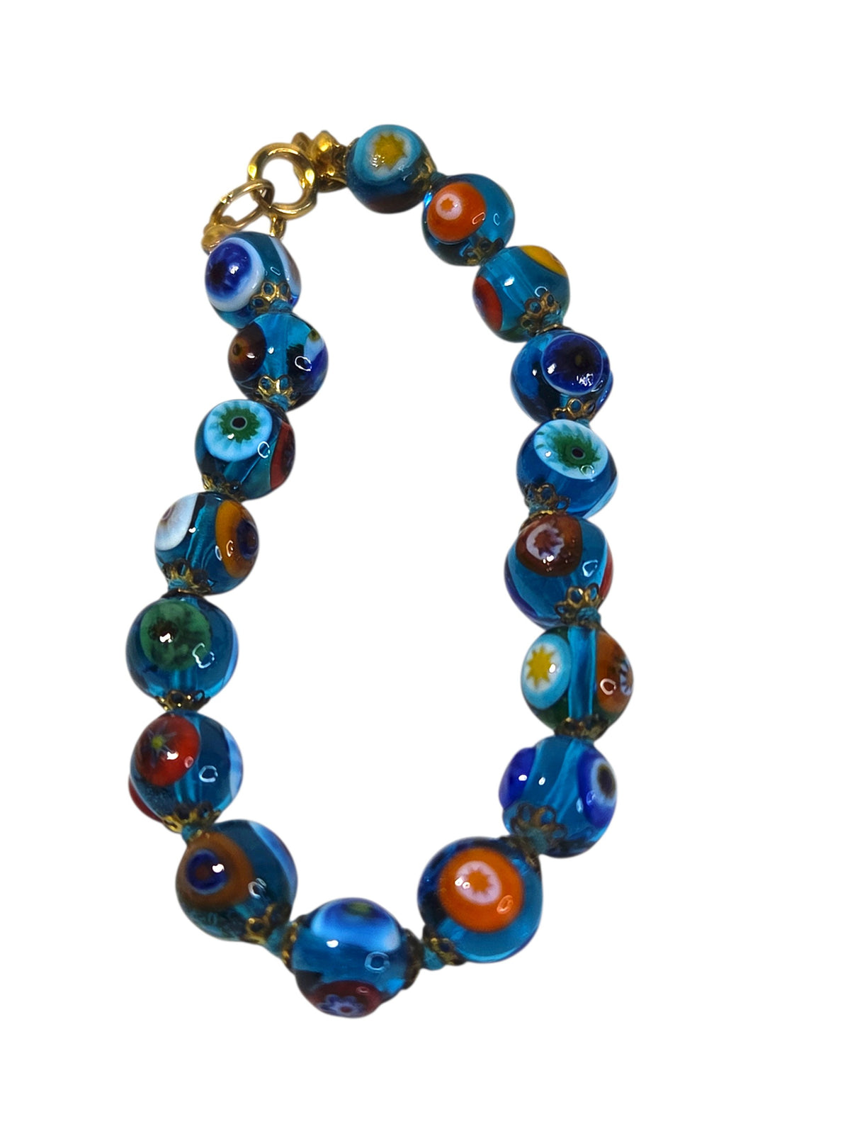 Aqua millefiori glass bead bracelet laid in a circle with its gold-tone spring ring clasp