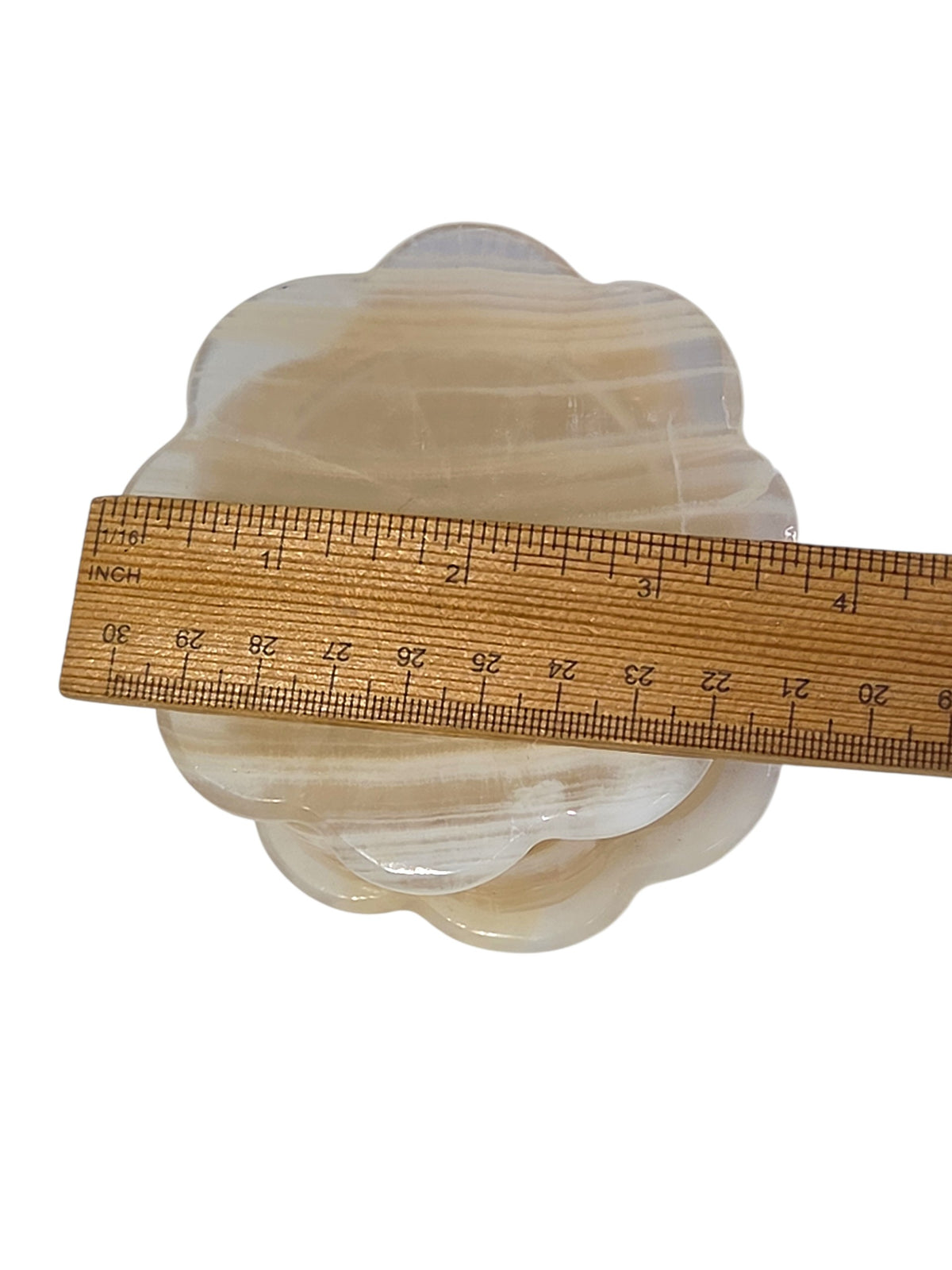 Honey onyx trinket box with a ruler for scale