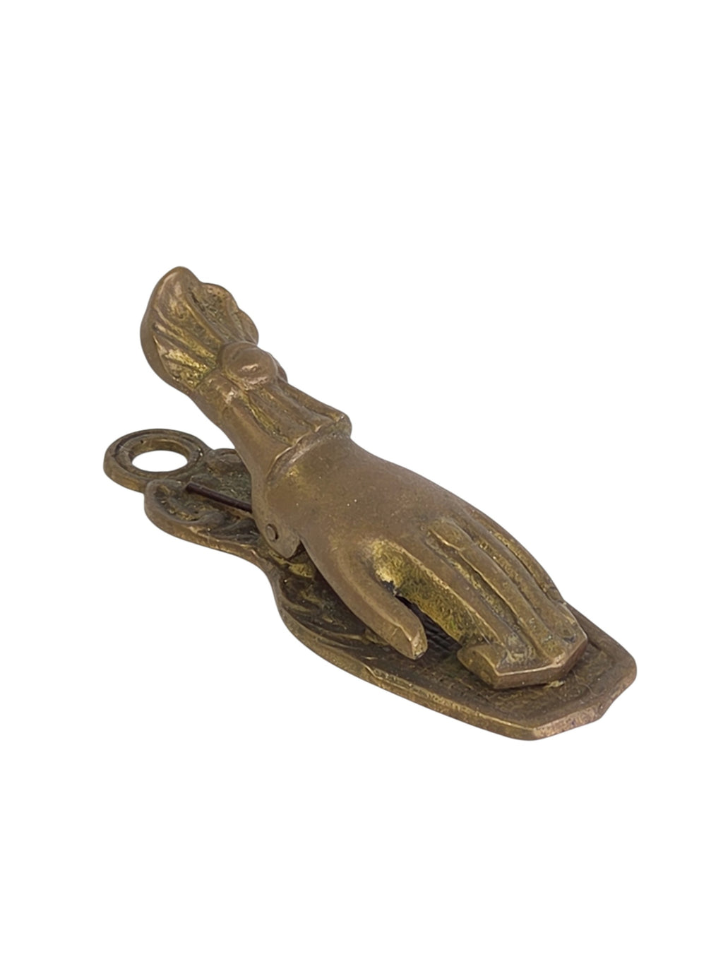 Brass lady's hand clip at an angle, with the spring hinge and hanging loop visible