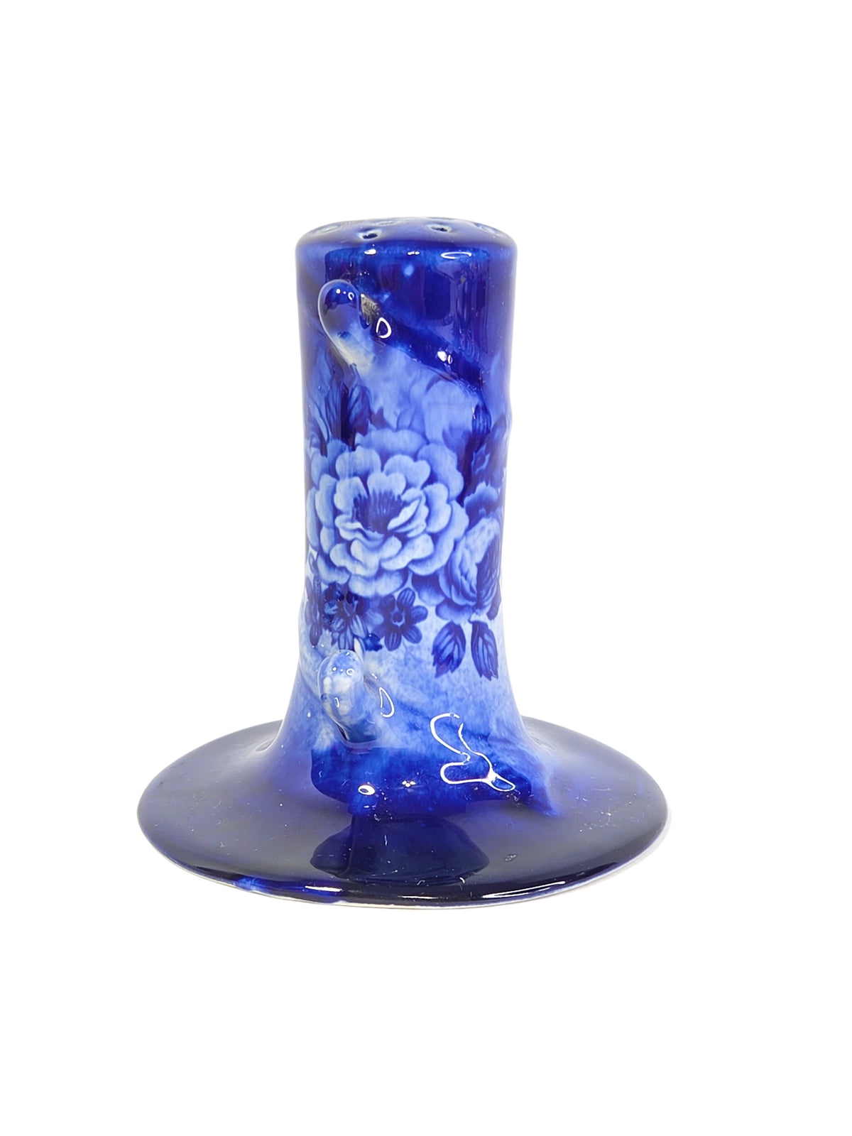 Flow blue style hatpin holder at an angle, showing the rose transfer and the small tan spot on a branch tip