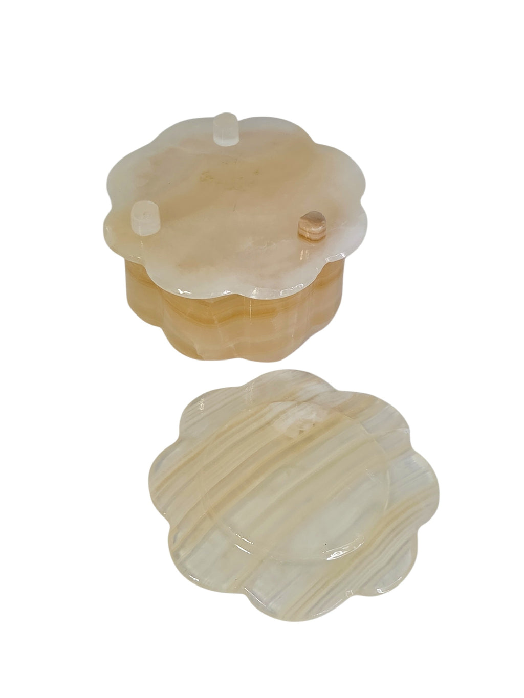 Open honey onyx flower box showing the polished interior, with the scalloped lid set beside it
