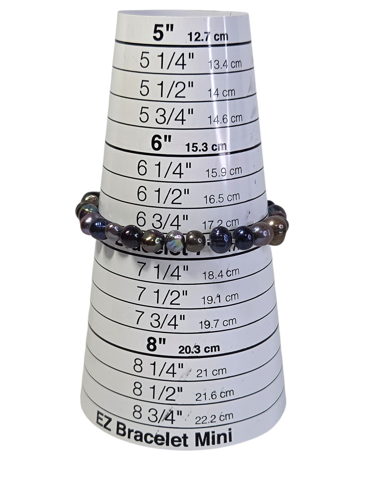 Freshwater pearl stretch bracelet on a bracelet sizing cone, sitting at about 7 inches