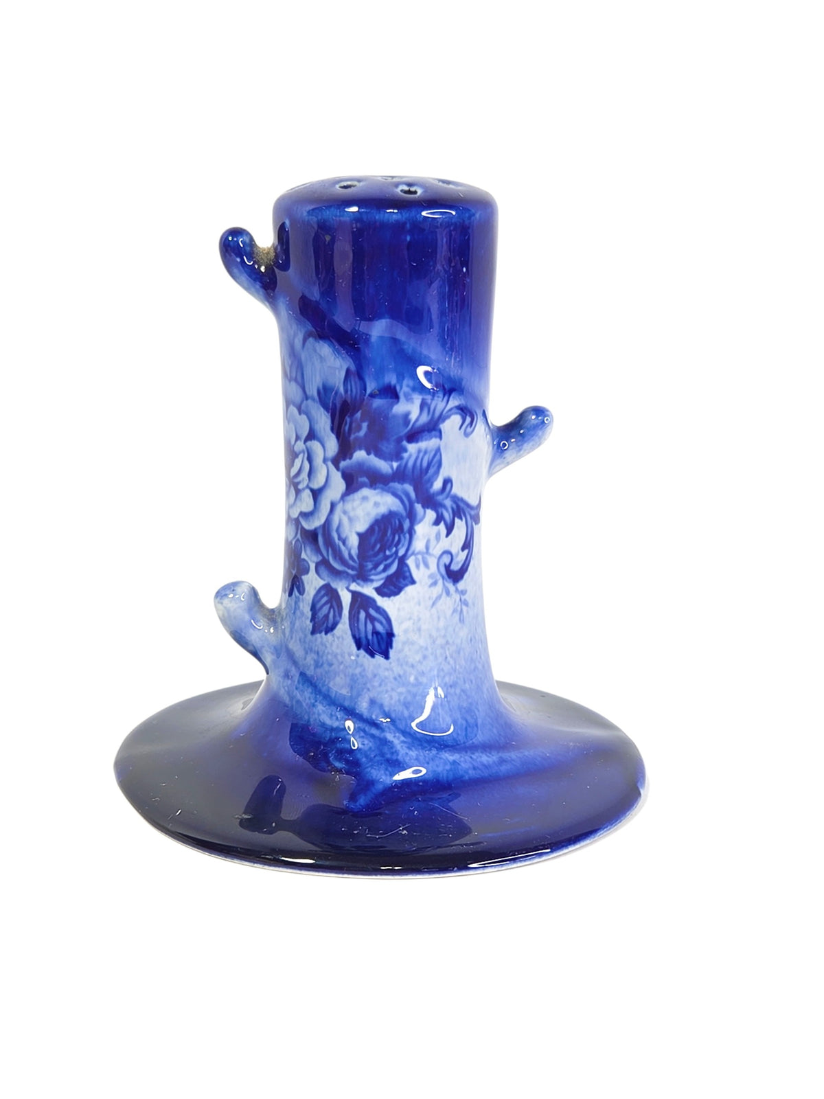 Cobalt blue and white tree stump hatpin holder beside a ruler, about 4 inches tall