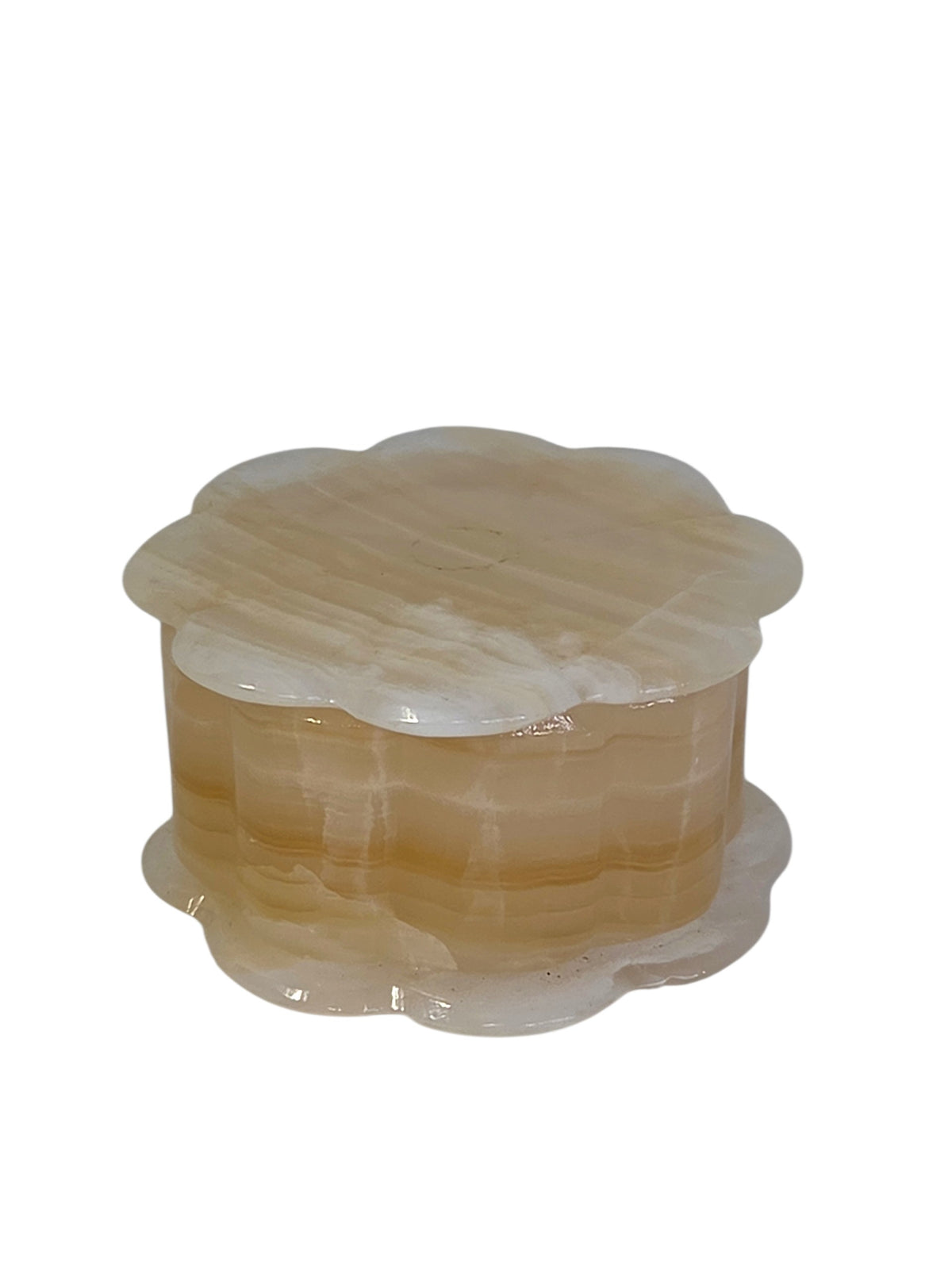 Honey onyx scalloped trinket box at an angle, with tiny natural pits near the base