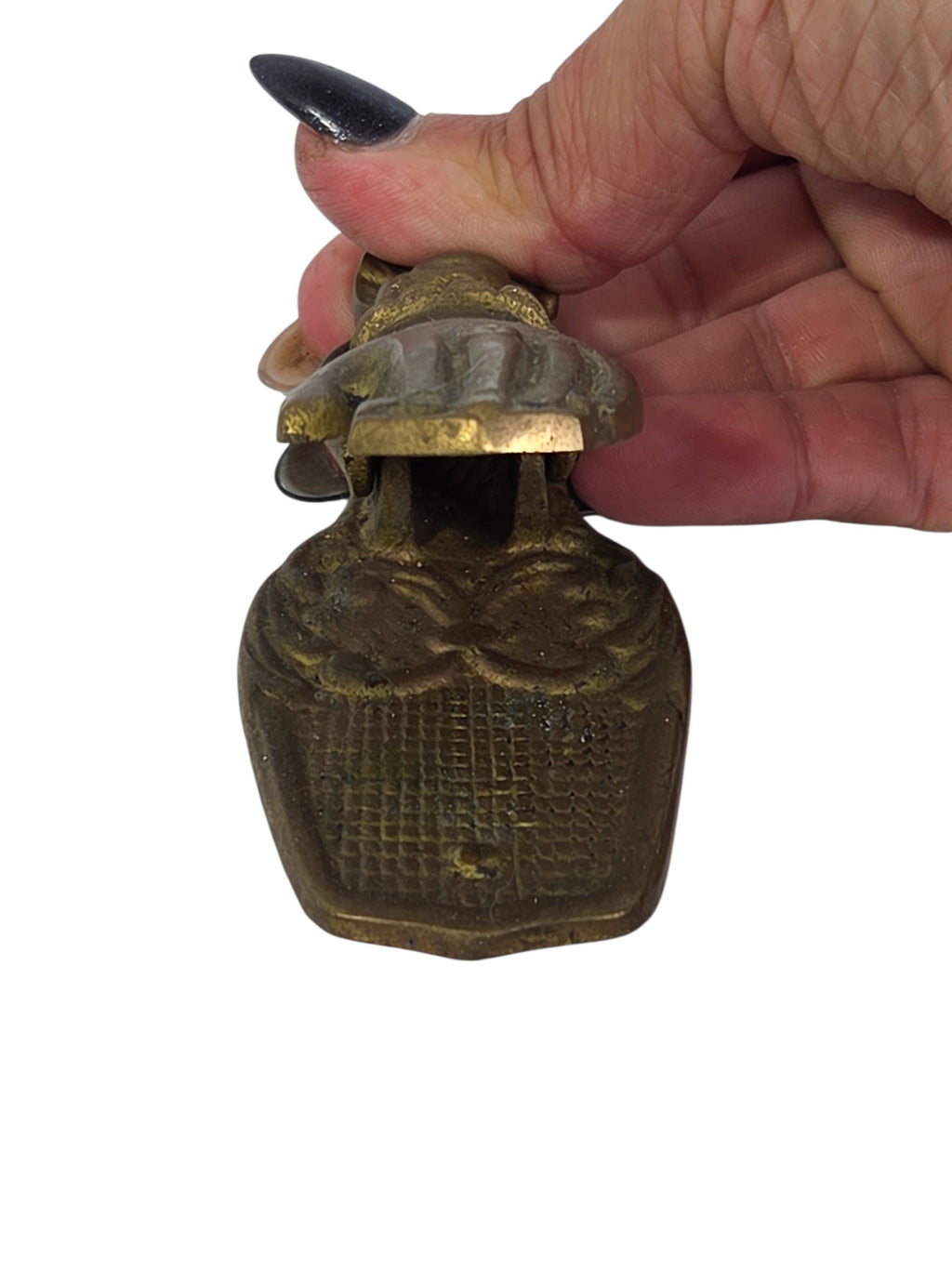 Top view of the brass hand clip showing the cuff, bow and long fingers