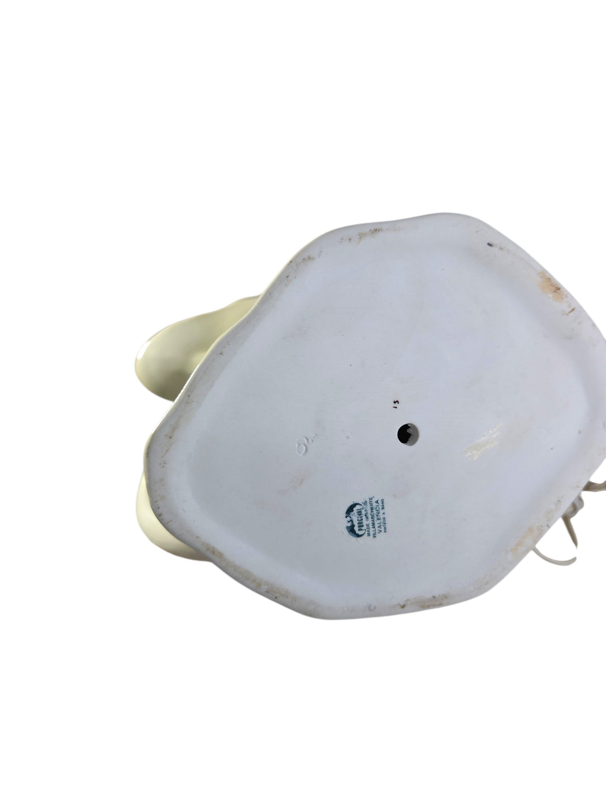 Unglazed bottom of the swan lamp with the Porceval Valencia stamp, incised mold number and grime around the edge