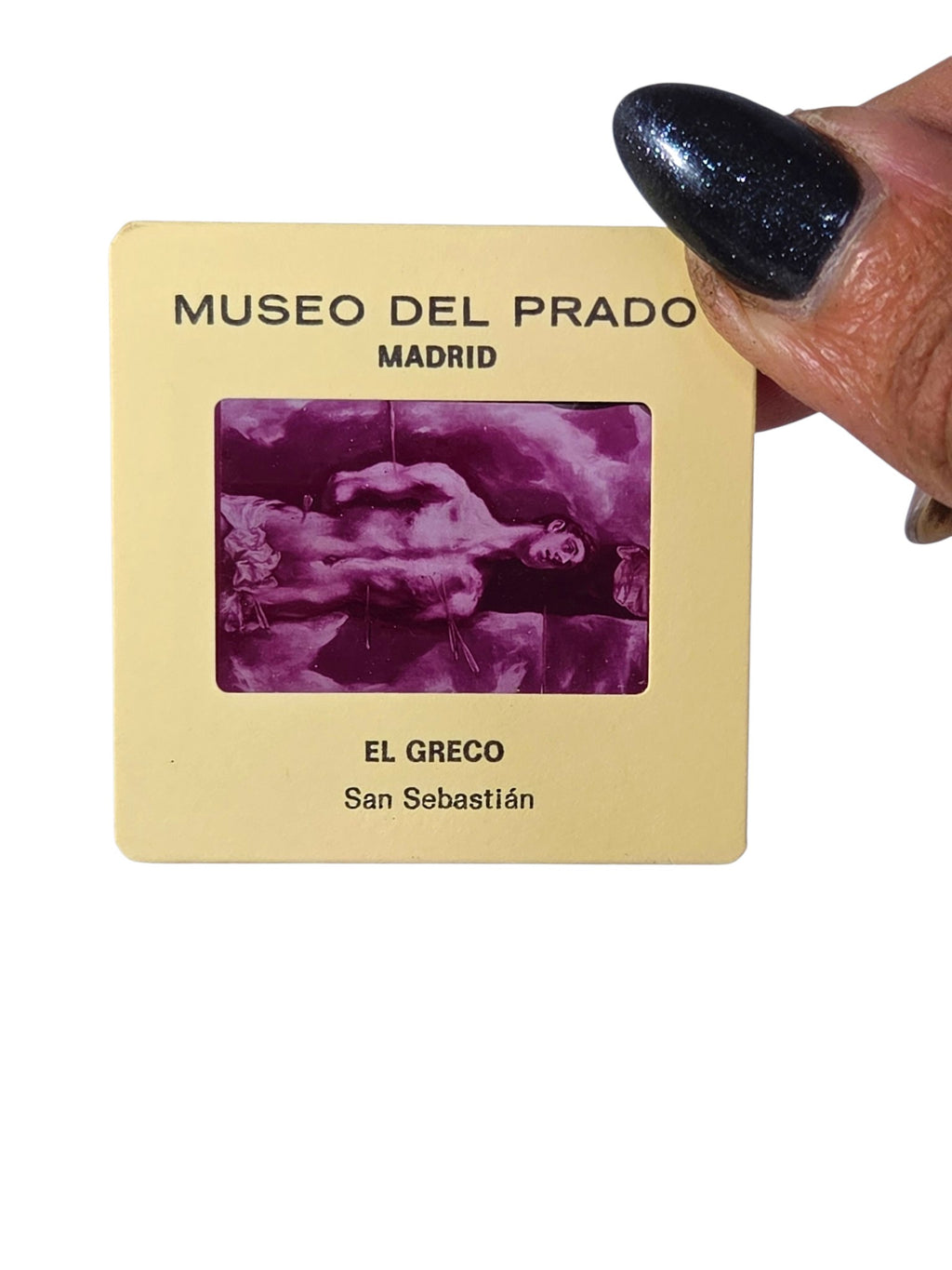 Museo del Prado souvenir slide of El Greco's San Sebastian held in hand, magenta-toned image in a cream mount