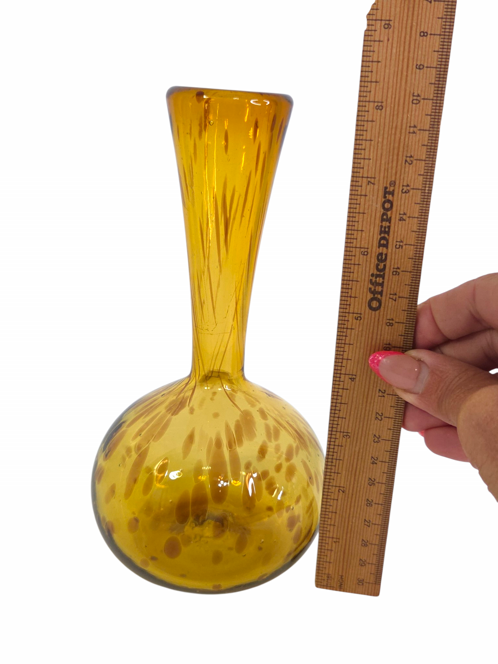 Oddly Darling Vintage hand blown amber glass bud vase with organic speckles and a bulbous base next to a ruler.