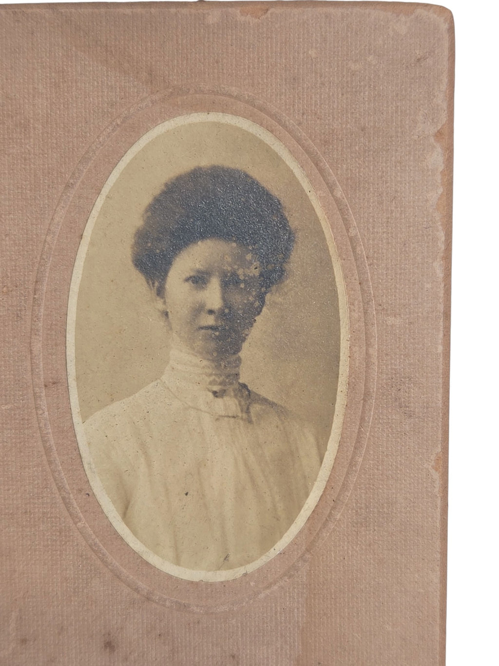 Oddly Darling Vintage Edwardian photograph of a young woman with pompadour hair on pink card mount