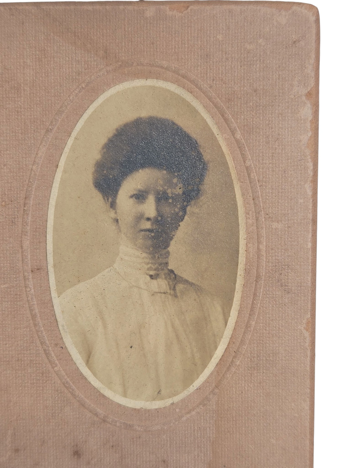 Oddly Darling Vintage Edwardian photograph of a young woman with pompadour hair on pink card mount