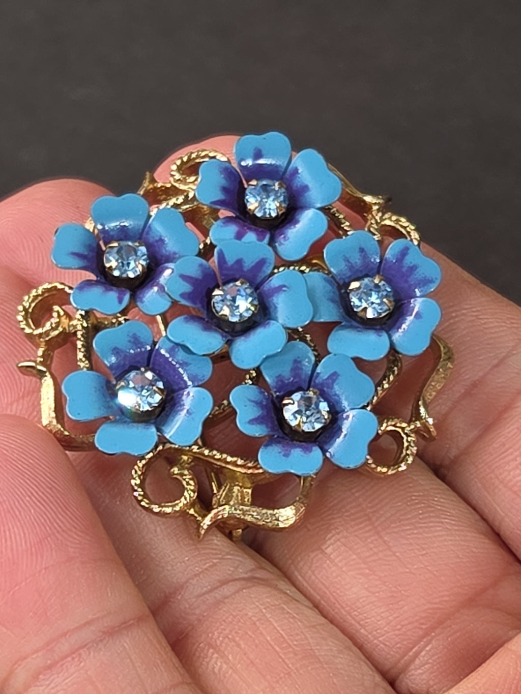 Oddly Darling Vintage AVON floral brooch with blue and purple enamel flowers and clear rhinestones on gold filigree