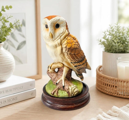 Oddly Darling Vintage Andrea by Sadek barn owl figurine with detailed feathers on a dark wooden pedestal base.