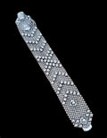Oddly Darling Vintage wide silver-tone cuff bracelet featuring intricate beaded mesh and shimmering faceted crystals.