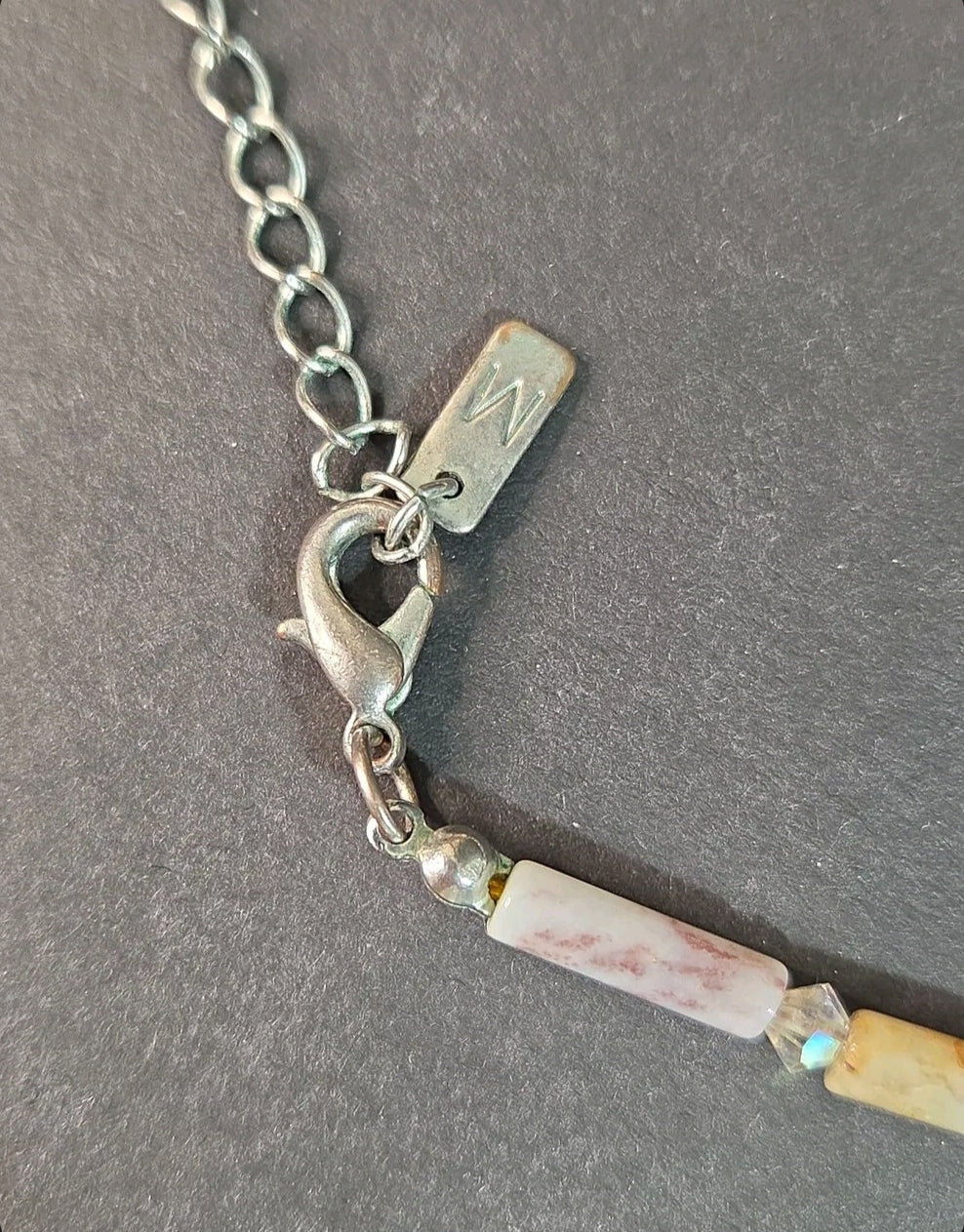 Oddly Darling Vintage artisan necklace featuring a silver lobster clasp, adjustable chain, and patterned stone beads.