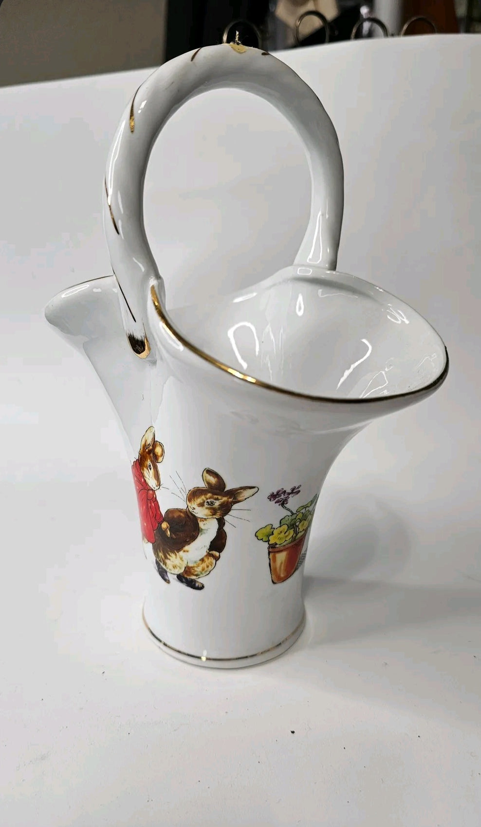 Oddly Darling Vintage white porcelain basket vase featuring Peter Rabbit and Benjamin Bunny with gold-tone trim.