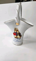 Oddly Darling Vintage white porcelain basket vase featuring Peter Rabbit and Benjamin Bunny with gold-tone trim.