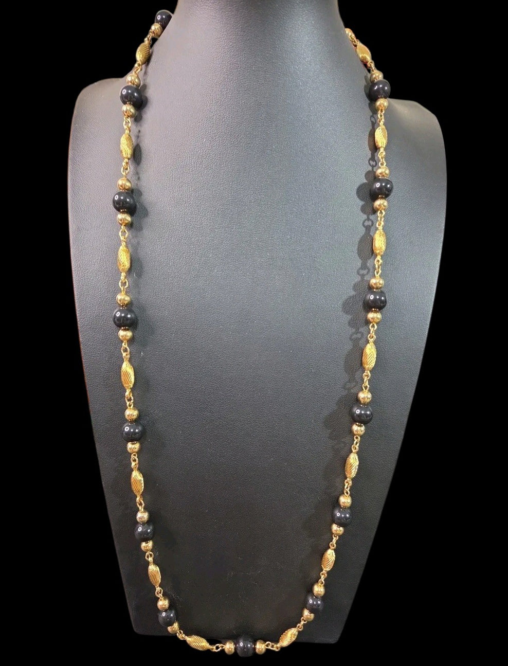 Oddly Darling Vintage long necklace with alternating polished black beads and textured gold-tone metal spacers