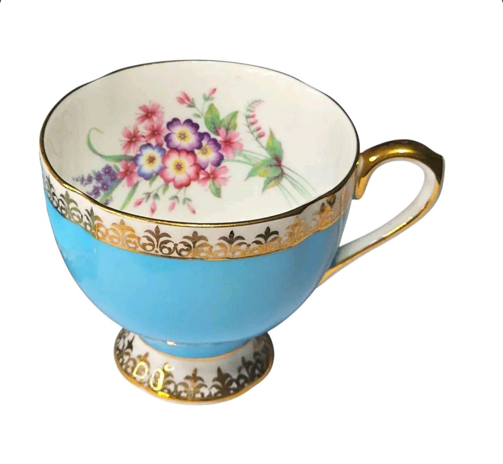 Oddly Darling Vintage sky-blue porcelain teacup with gold filigree trim and delicate hand-painted floral interior