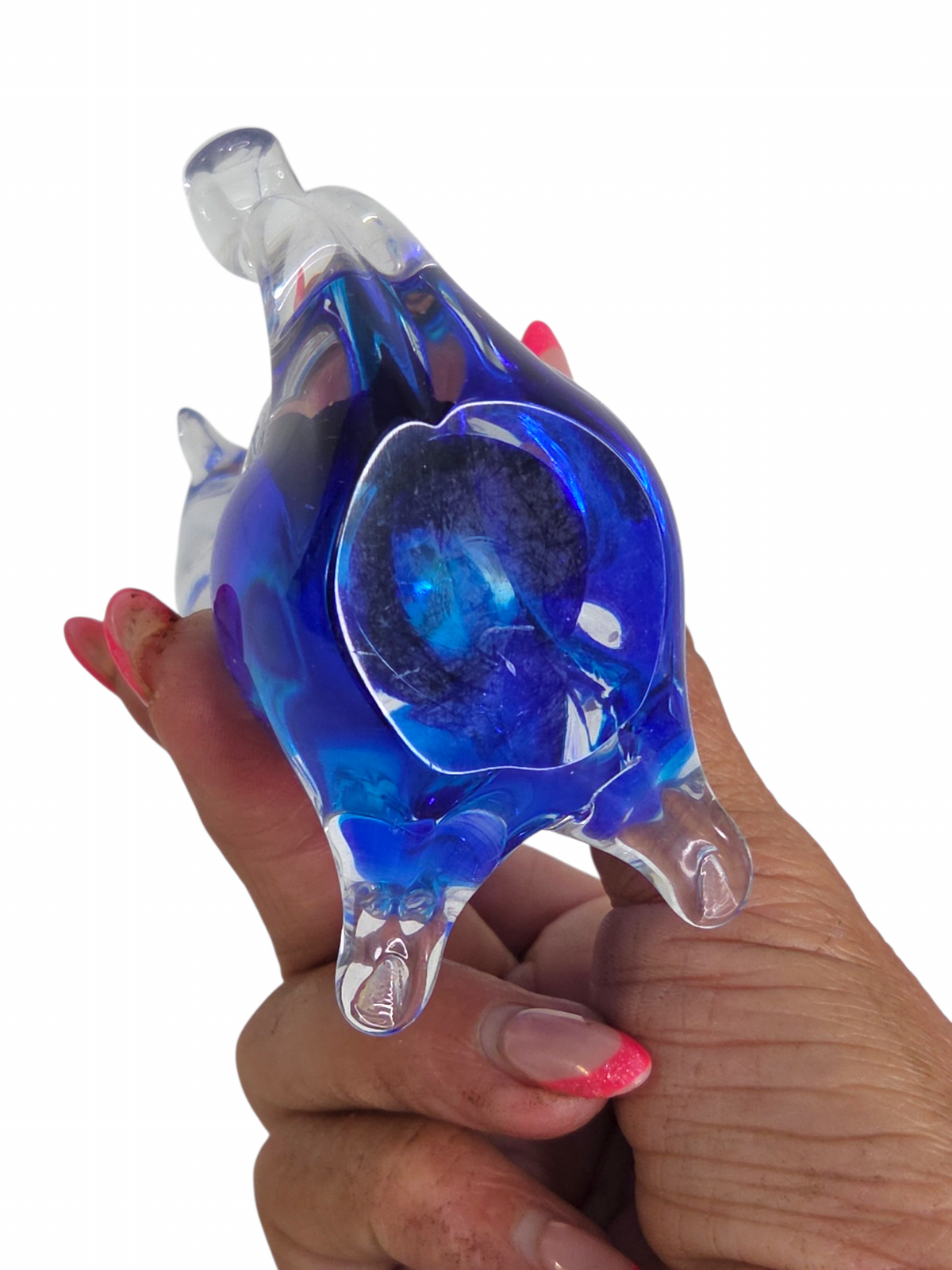 Oddly Darling Vintage handcrafted clear and blue glass cat figurine held in a hand, showing artistic fluid design.