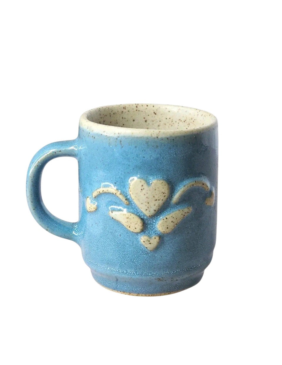 Oddly Darling Vintage handcrafted blue ceramic coffee mug with a raised heart motif and speckled cream interior.