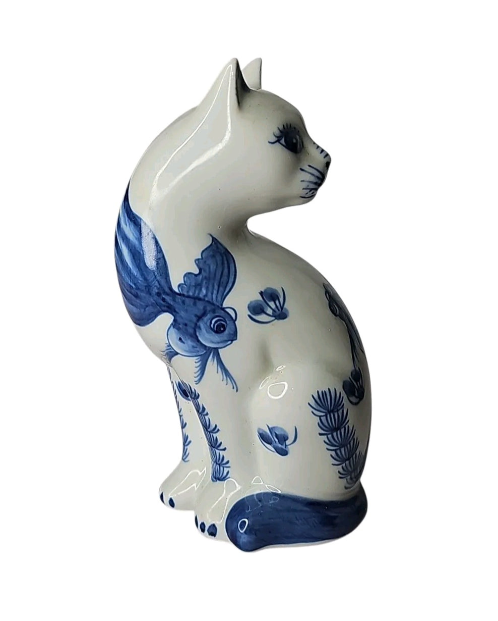 Oddly Darling Vintage ceramic cat figurine with blue and white hand-painted goldfish and botanical motifs.