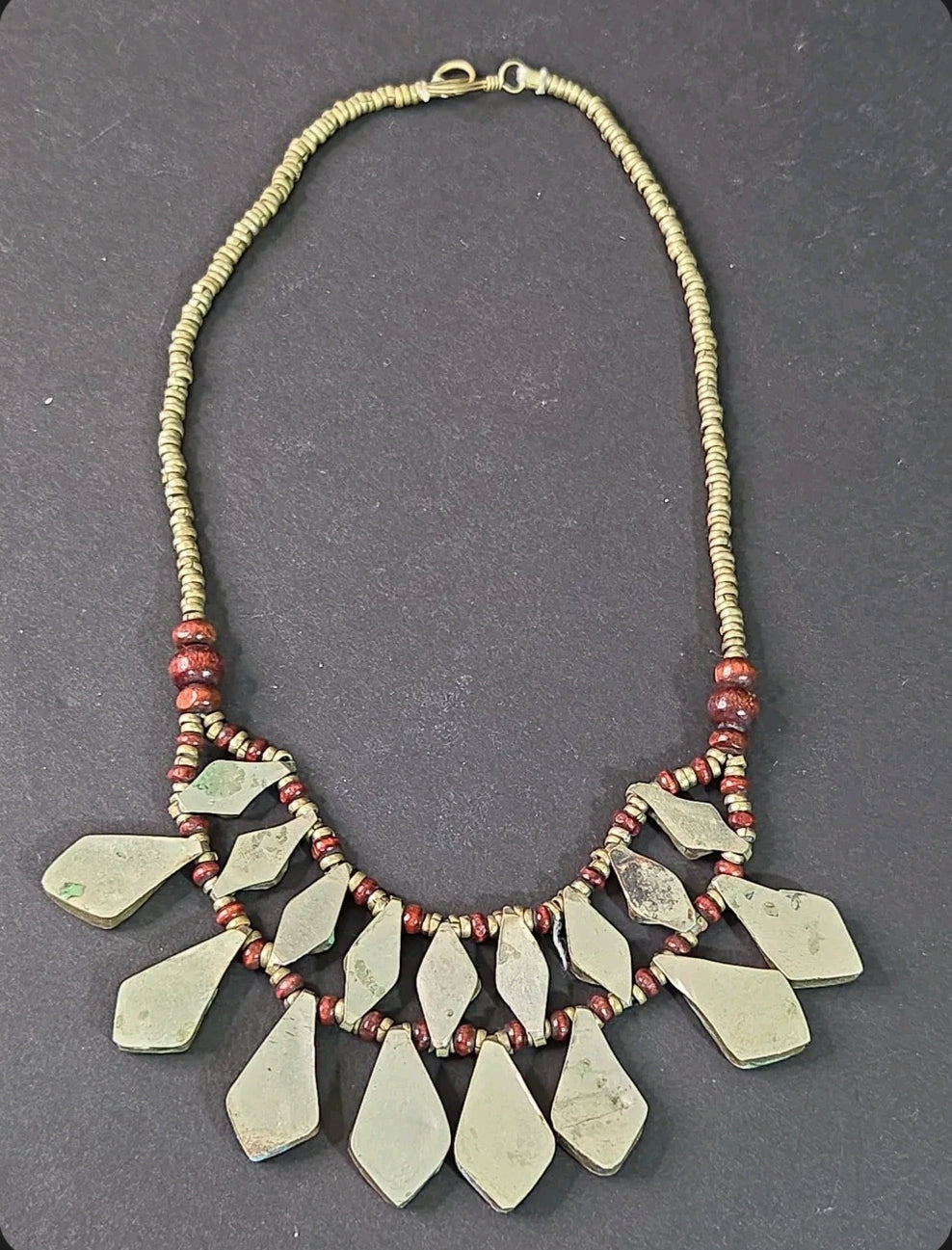 Oddly Darling Vintage bohemian layered statement necklace with rustic metal geometric pendants and wooden beads.