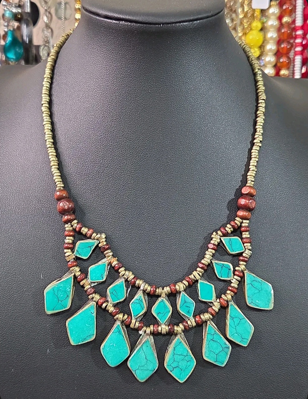 Oddly Darling Vintage bohemian layered statement necklace with turquoise stone inlays, wooden beads, and antiqued metal.