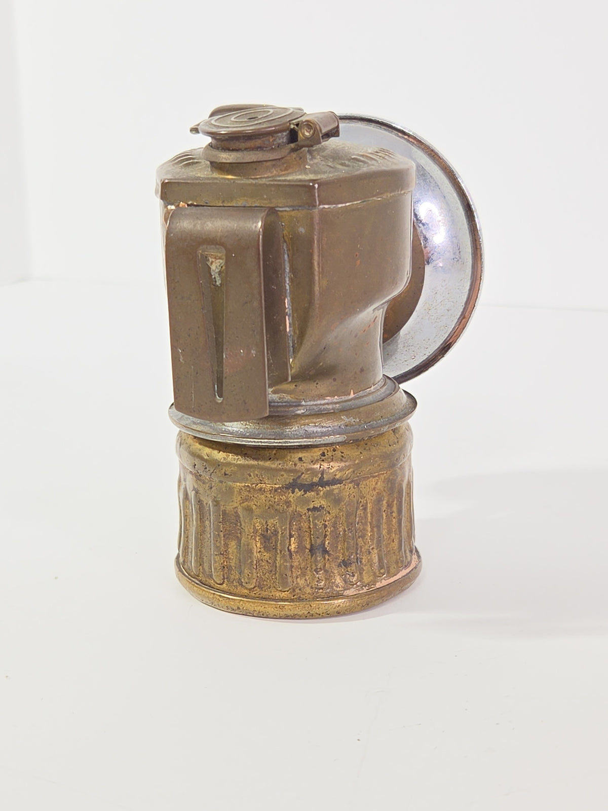 Oddly Darling Vintage antique brass carbide miner lamp with a weathered patina and reflective chrome-plated dish
