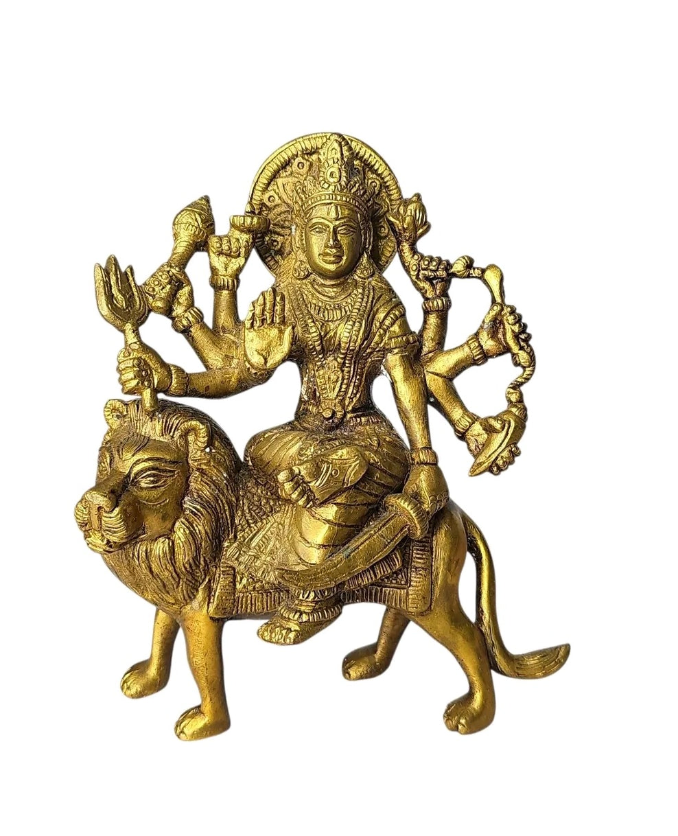 Oddly Darling Vintage handcrafted brass Goddess Durga statue riding a lion with intricate gold-toned metal carvings.