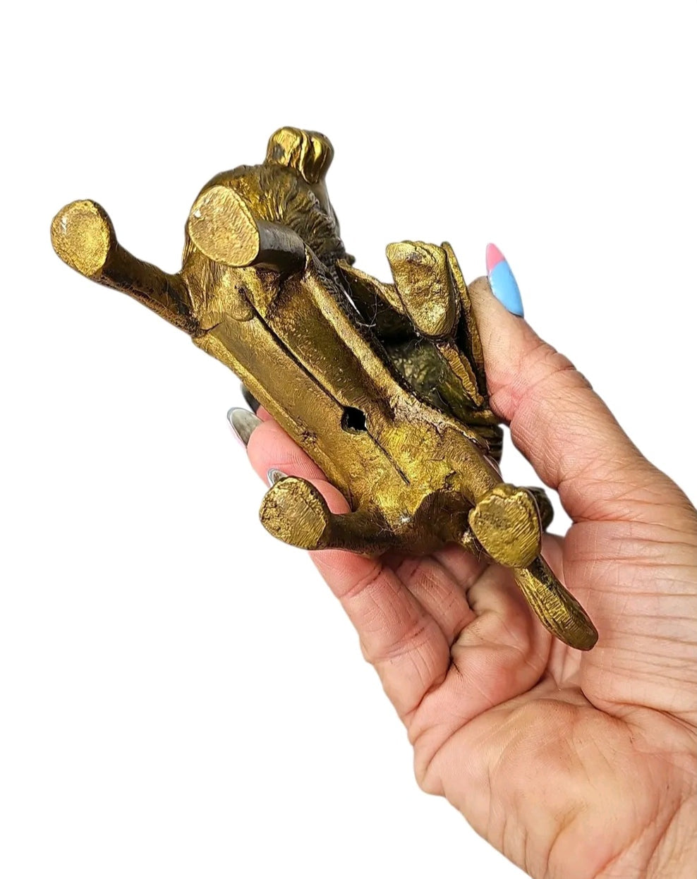 Oddly Darling Vintage brass Goddess Durga on lion statue held in hand showing the base and intricate metal casting.