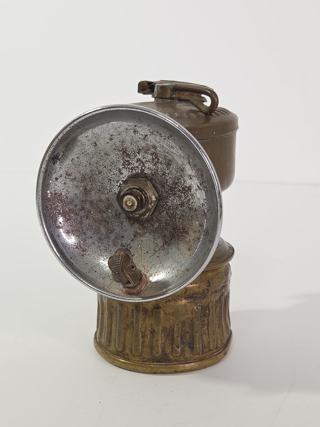 Oddly Darling Vintage antique brass miner carbide lamp with a weathered chrome-plated reflector dish.