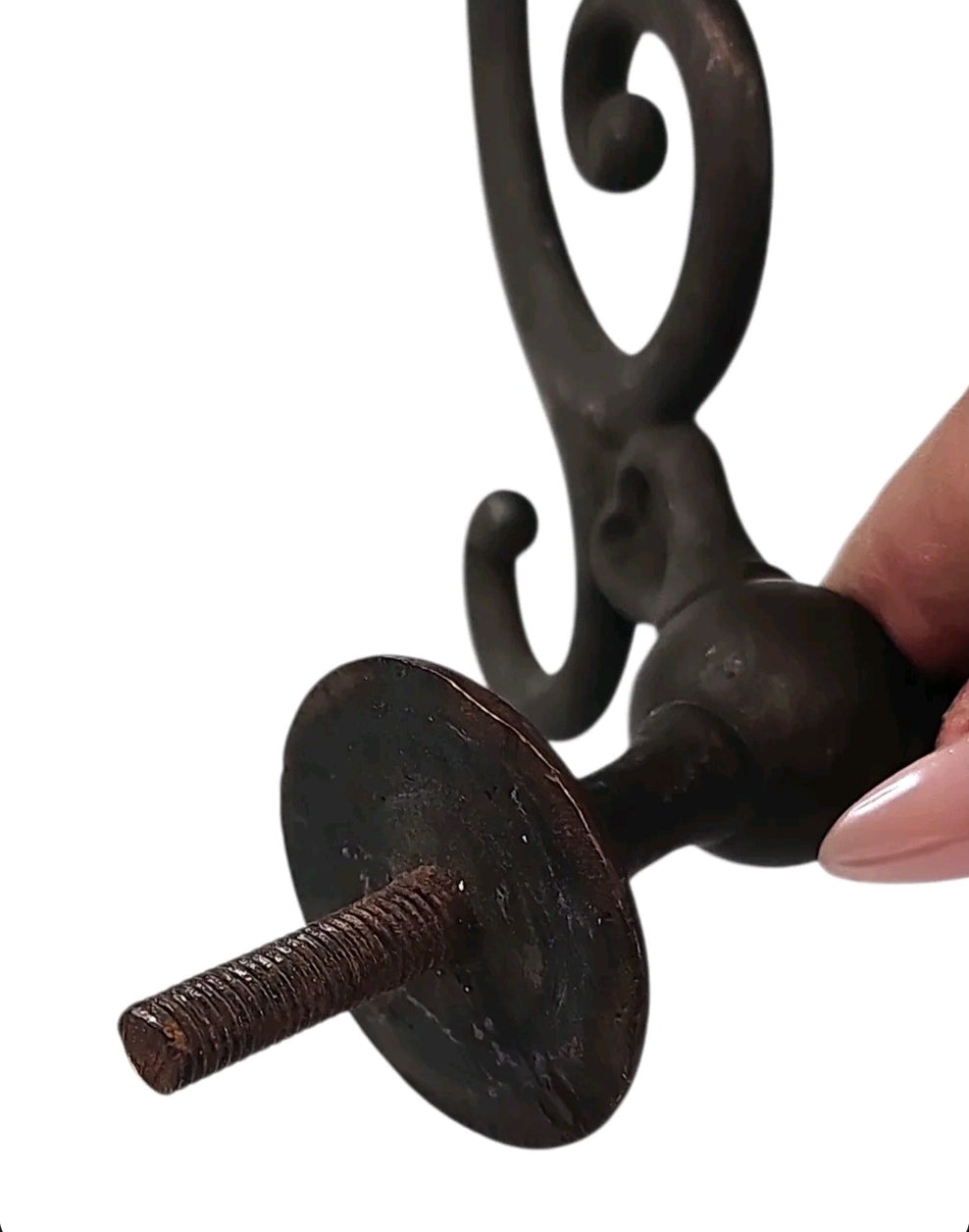 Oddly Darling Vintage ornate dark bronze metal wall hook with intricate scrollwork and threaded mounting bolt