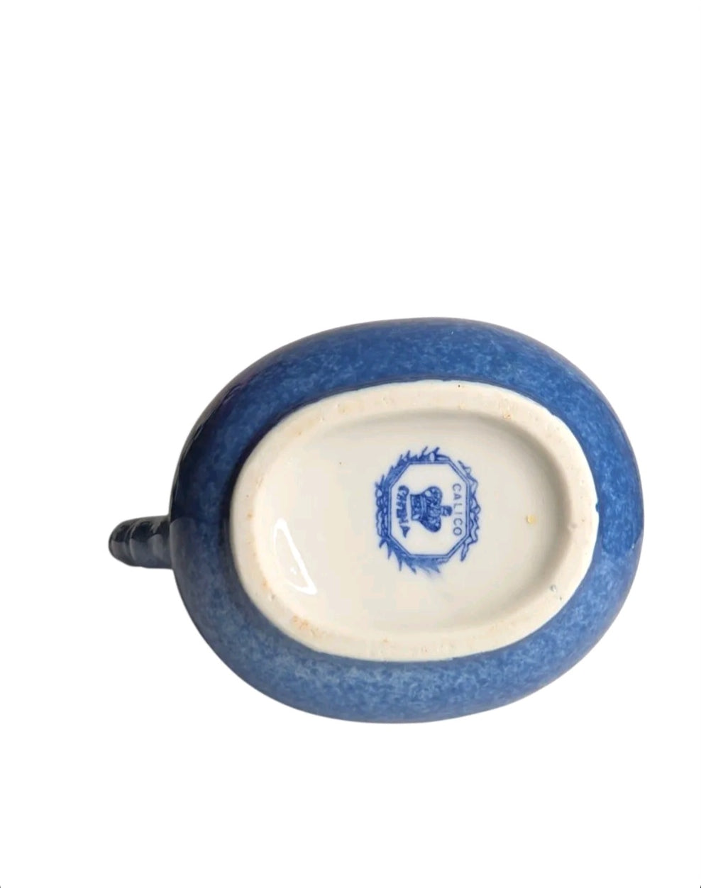 Oddly Darling Vintage ceramic pitcher base showing the blue sponge-ware finish and the Calico China maker's mark