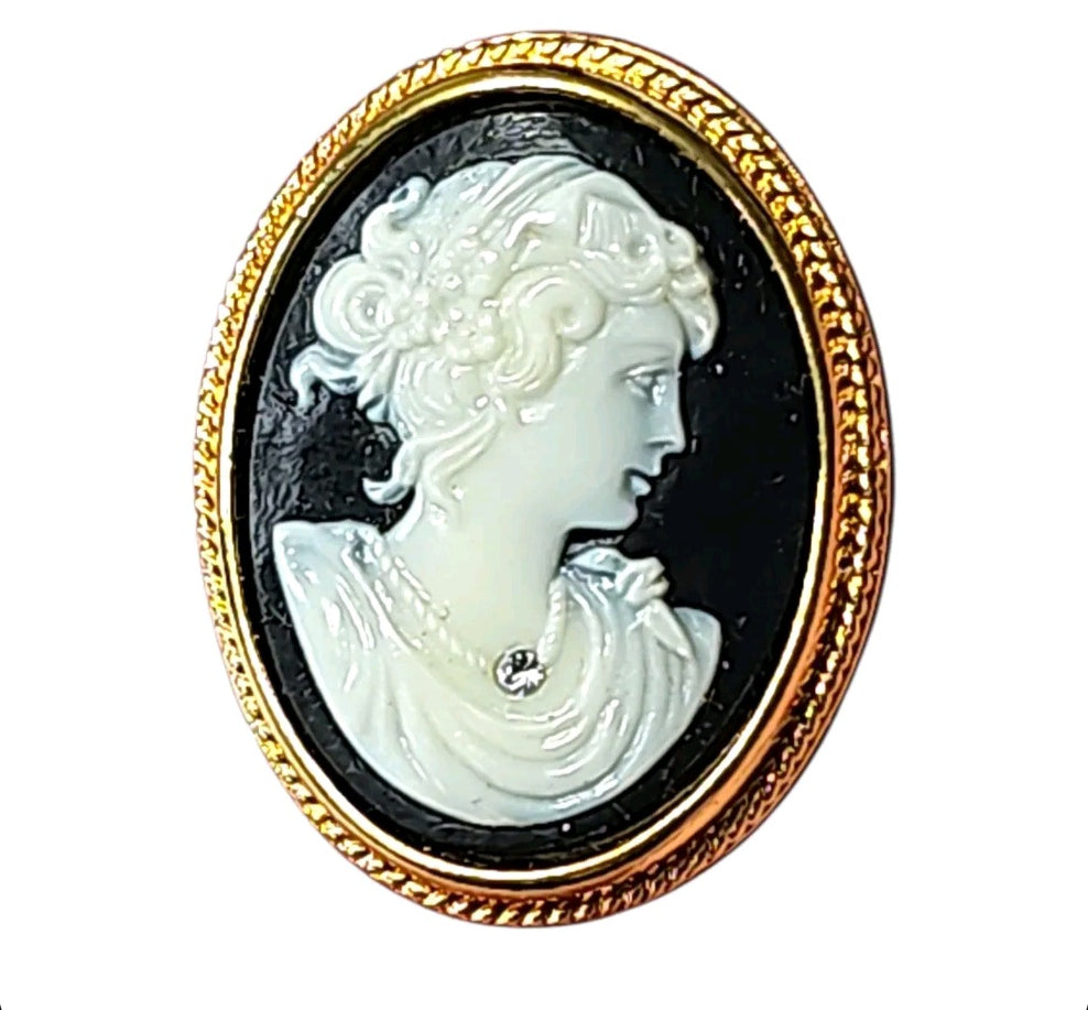 Oddly Darling Vintage cameo brooch featuring a white profile portrait on black with a gold rope-style frame.