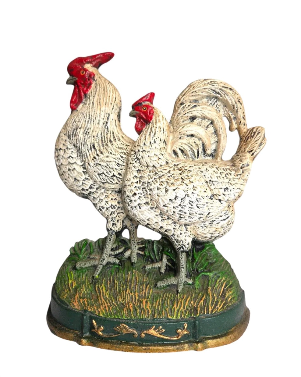 Oddly Darling Vintage cast iron rooster and hen doorstop with rustic hand-painted finish on a textured grass base.