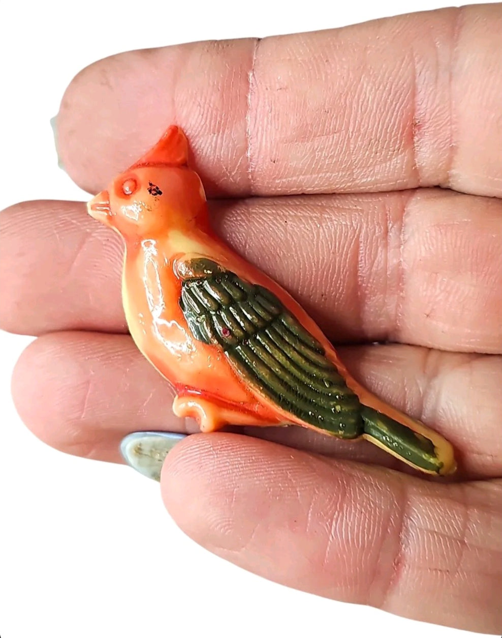 Oddly Darling Vintage miniature ceramic cardinal bird magnet with orange and green hand-painted details held in hand