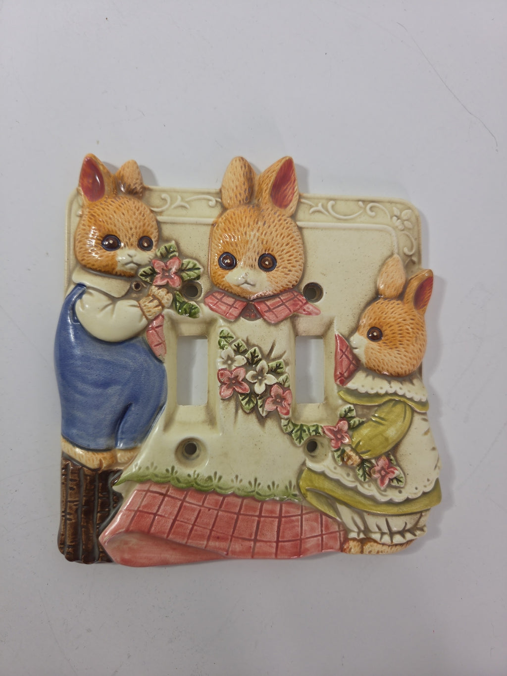 Oddly Darling Vintage ceramic double light switch cover featuring three hand-painted bunnies in cottagecore outfits.