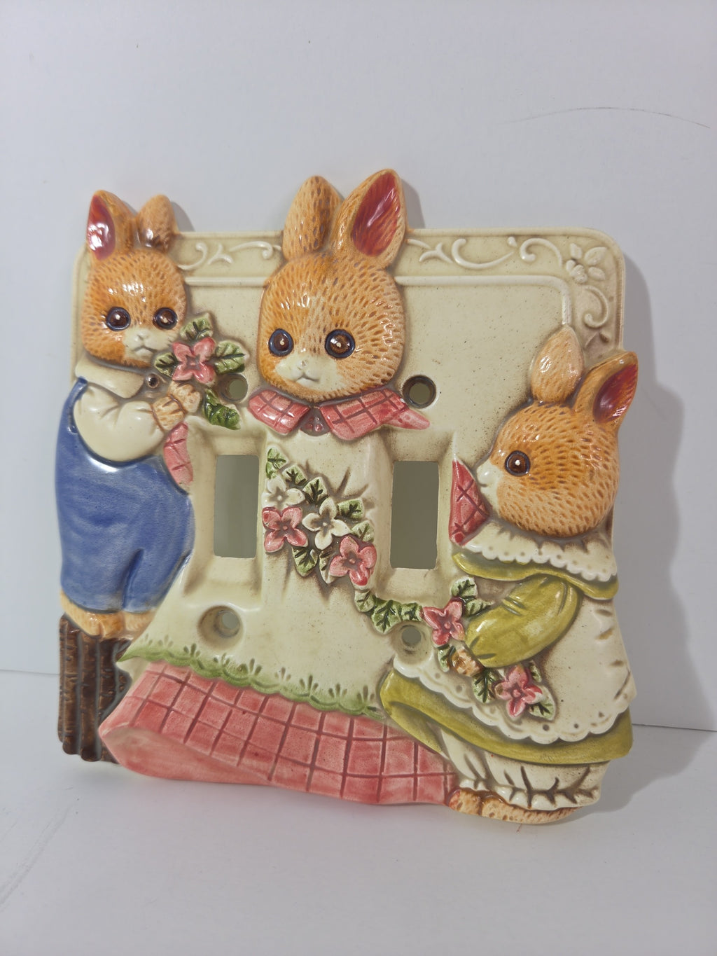 Oddly Darling Vintage ceramic double light switch plate featuring three hand-painted bunnies in cottagecore outfits.